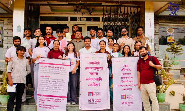 Participants holding two tall banners about equality and rights outside the venue